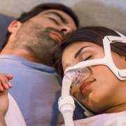Man and woman with CPAP sleeping