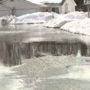 Home with snow and water causing floods Home with snow and water causing floods
