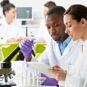 Hard Working Technicians Working In Laboratory Lab setting with lab techs working in Laboratory