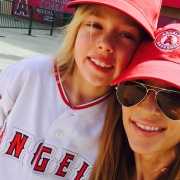 Mother holding son with autism Mother and son with baseball caps