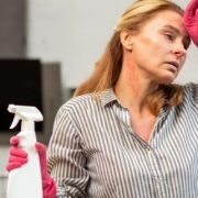 Multiple chemical Sensitivity Woman getting a headache from spraying chemicals