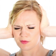 Mold on corn can cause headaches Woman holding her head