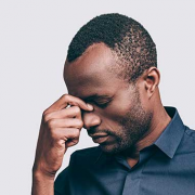 fugal sinus infection Man of color holding his nose because of mold infection